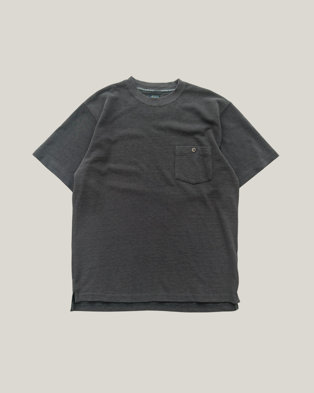 Dark gray Snickers work t-shirt with a pocket on a chest and a small button on it.