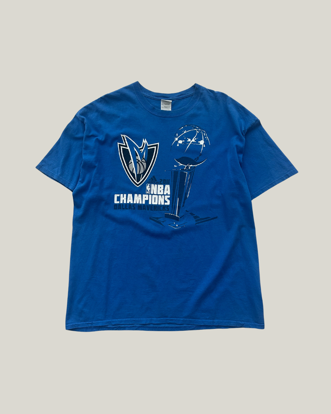 Blue t-shirt with NBA Champions logo on a gray background