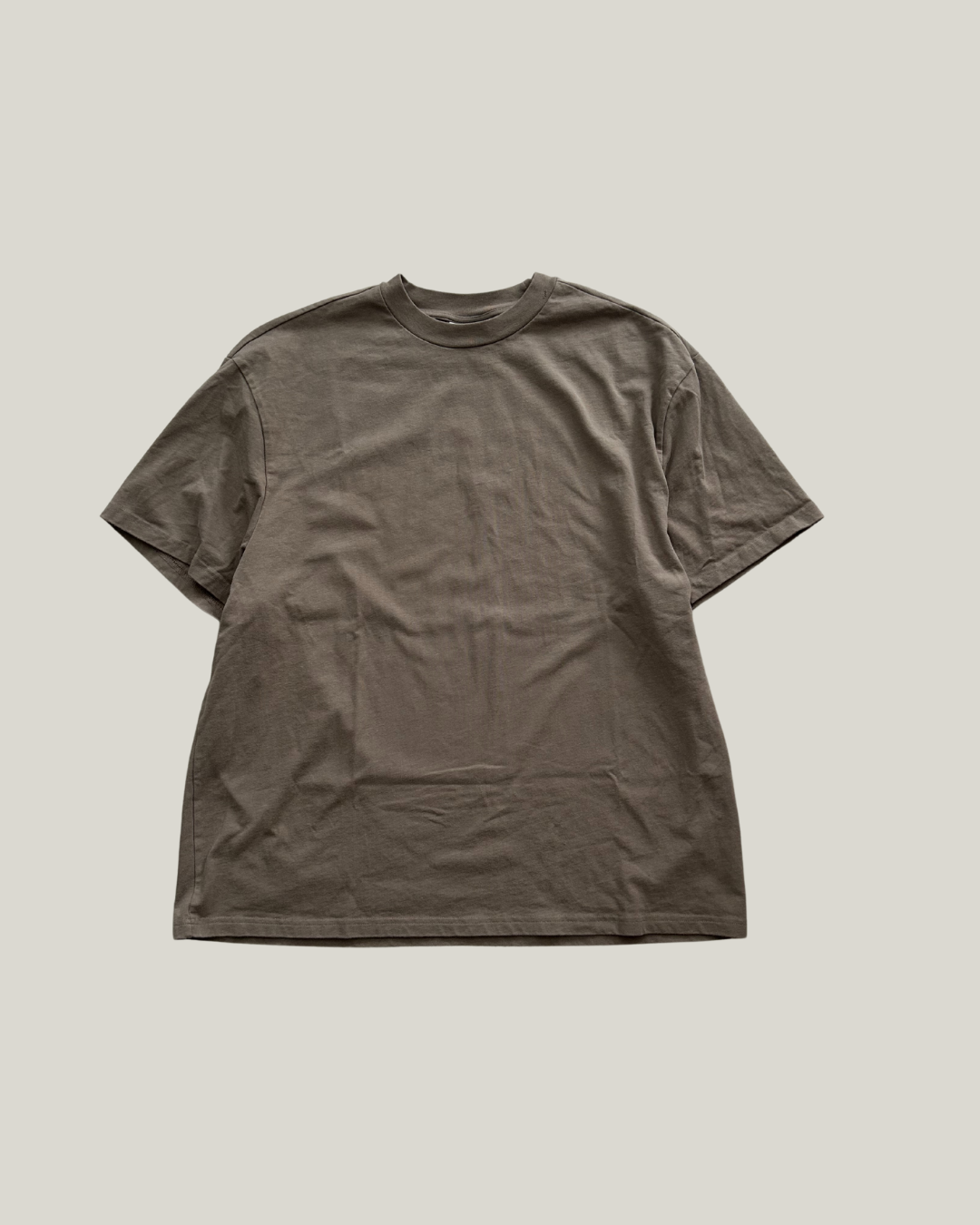 Brown t-shirt on a light gray background