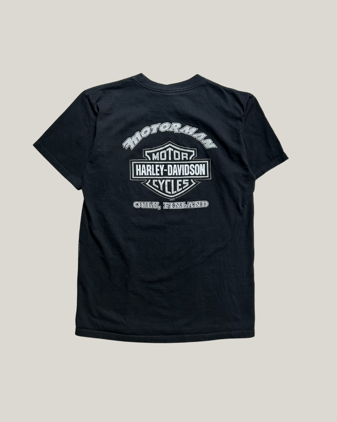 Black t-shirt with Harley-Davidson logo on a light gray background