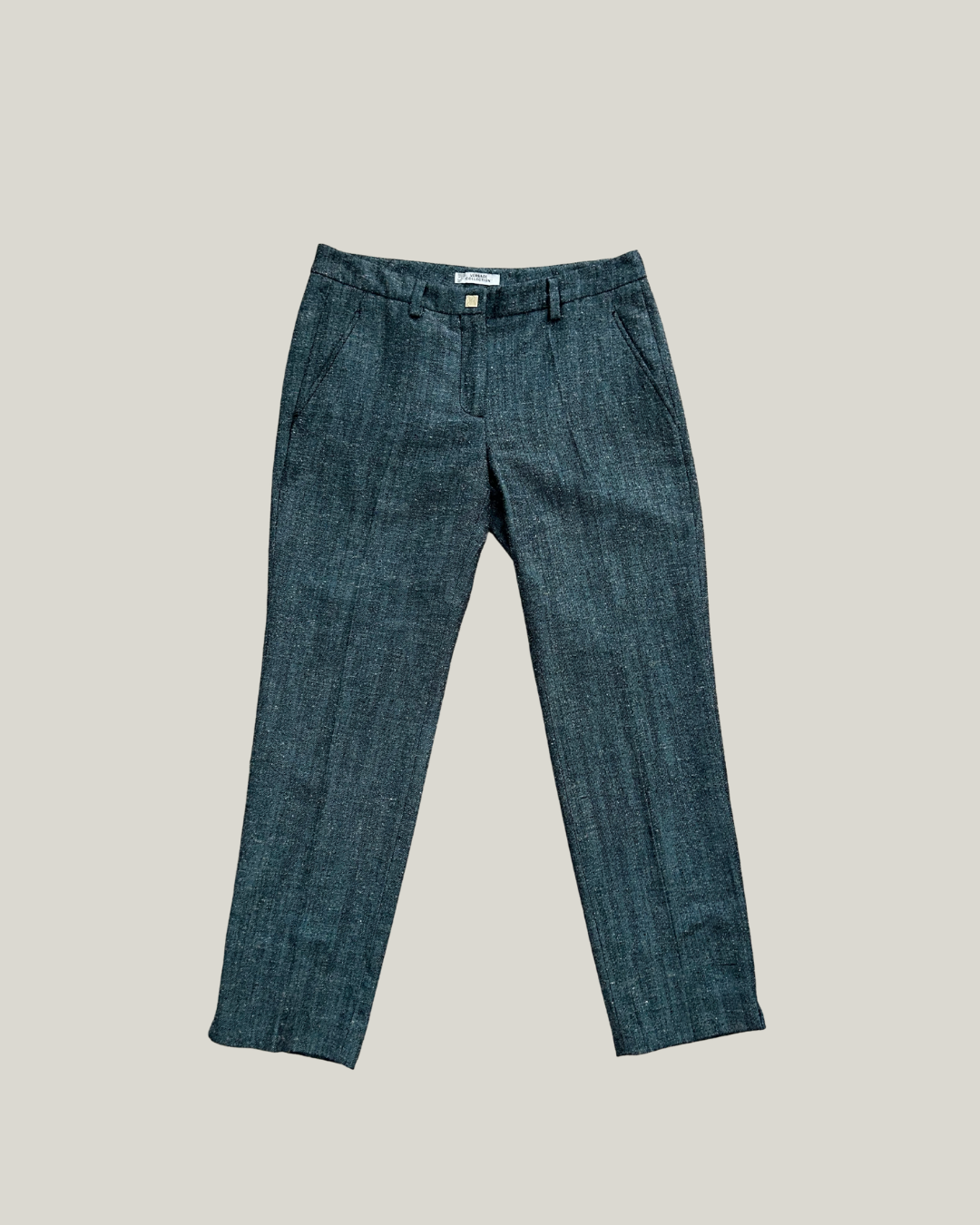 Blue versace pants on a beige background