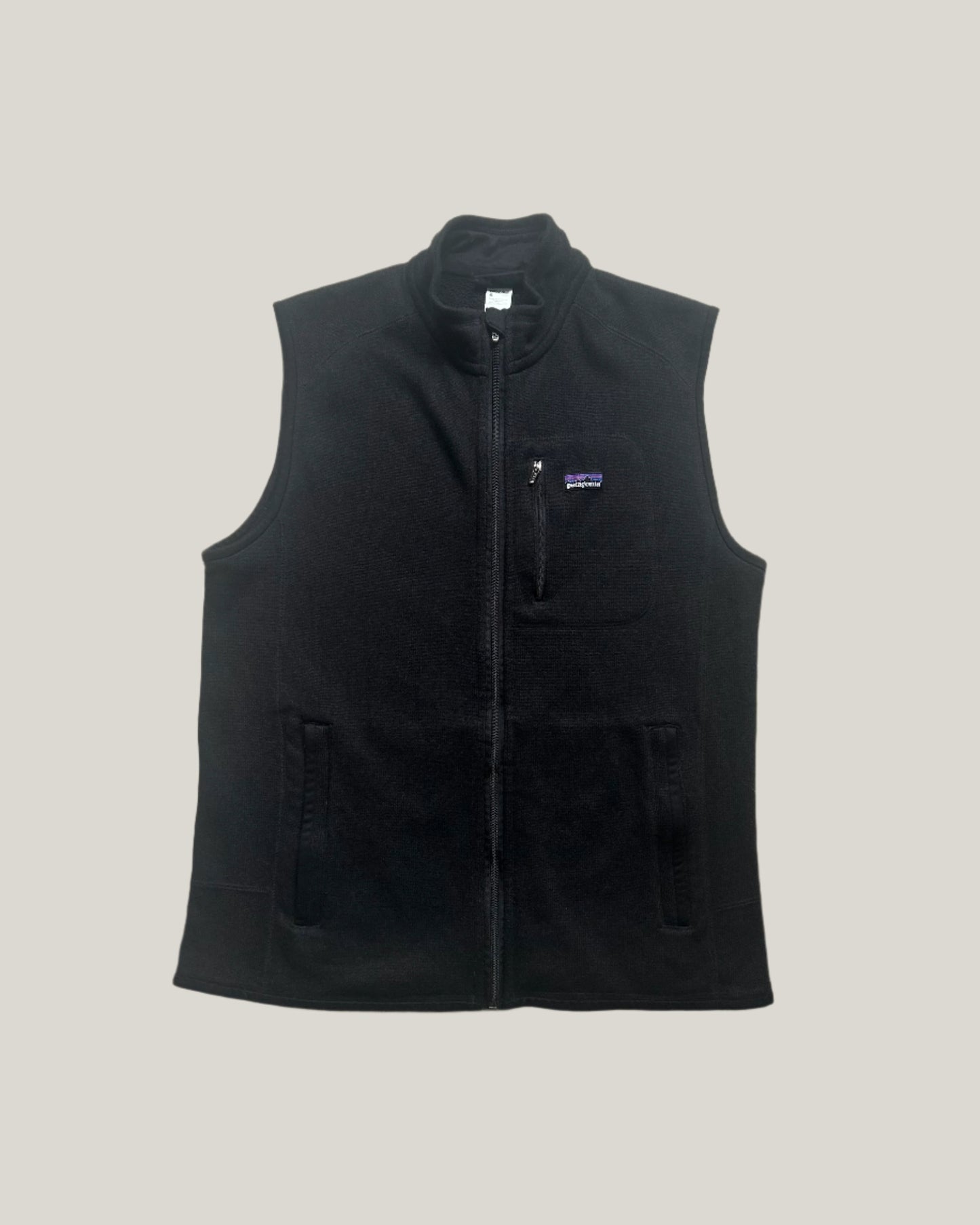patagonia fleece vest in black, featuring a sleek and functional design with three zippered pockets (two hand pockets and one chest pocket), full-zip front, and a high collar