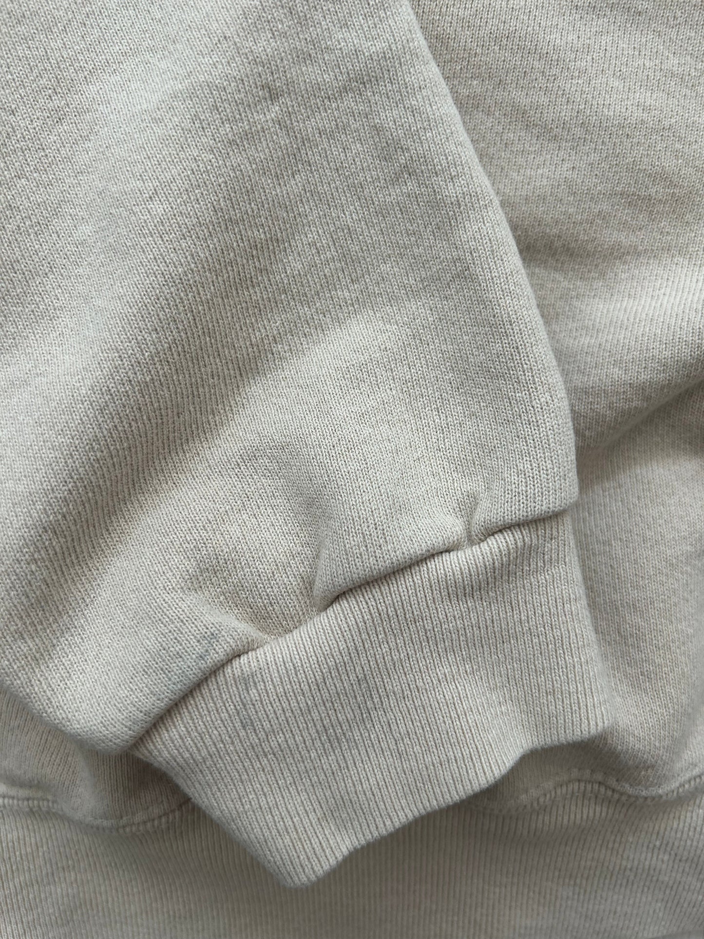 Close-up of beige fabric with a focus on texture and color.