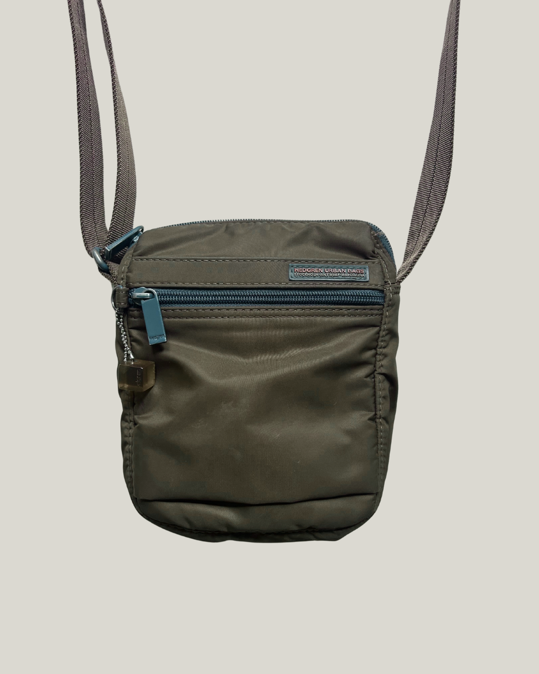 Close-up of brown Hedgren Urban Bags crossbody bag with zip on front