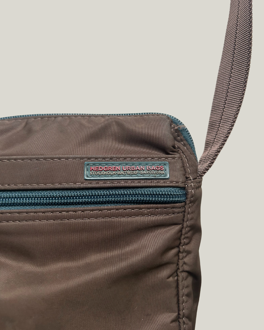 Close-up of brown Hedgren Urban Bags crossbody bag with zip on front