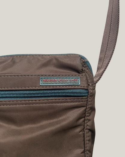 Close-up of brown Hedgren Urban Bags crossbody bag with zip on front