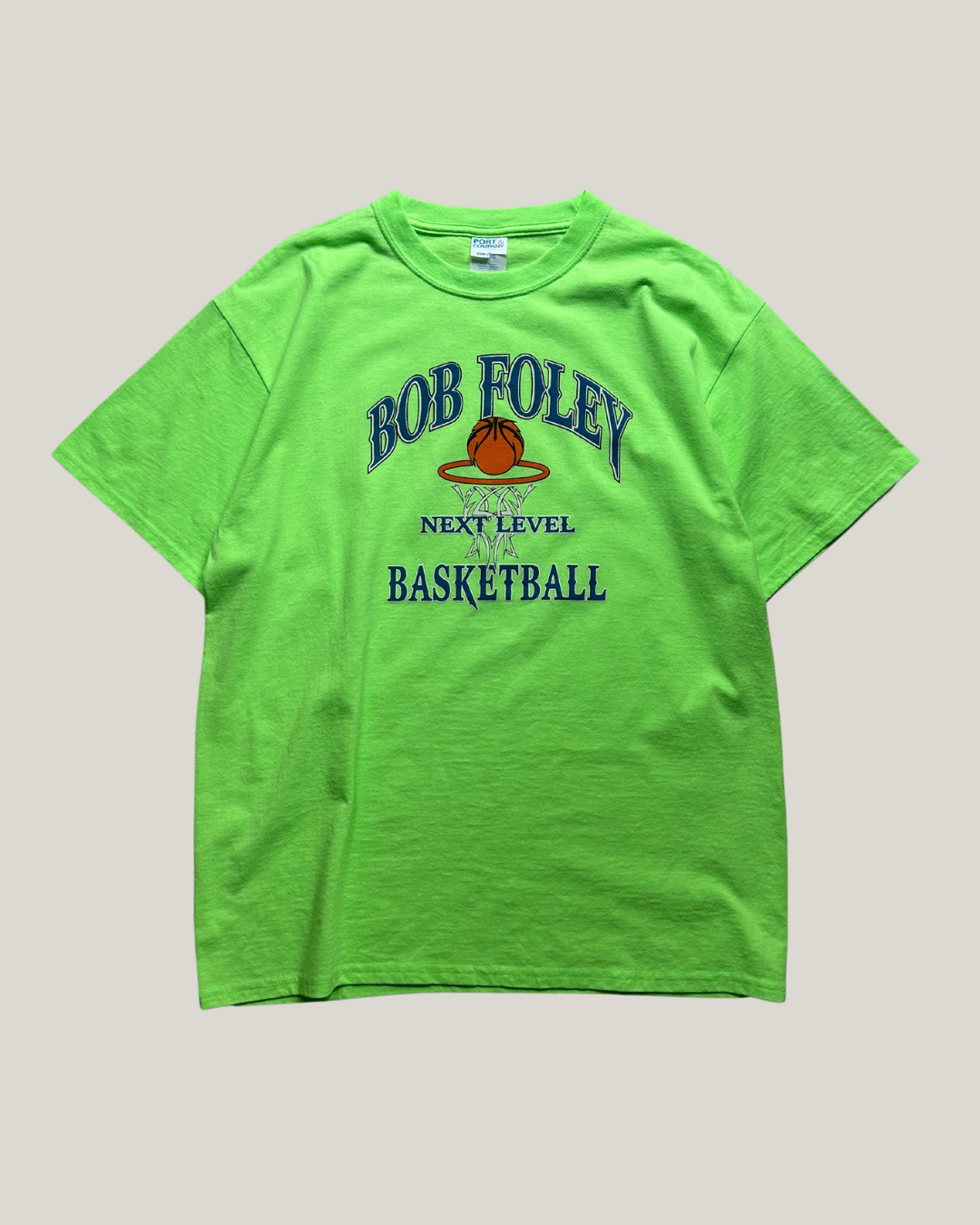Green t-shirt with 'Bob Foley Next Level Basketball' text and logo on a gray background