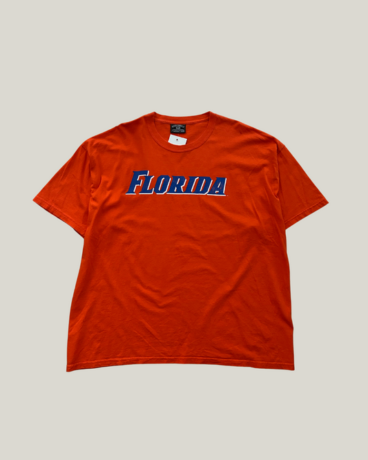Orange t-shirt with 'FLORIDA' printed on it against a gray background