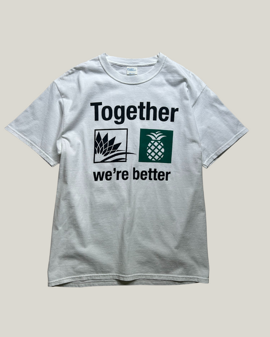 White t-shirt with 'Together we're better' text and symbols on a beige background